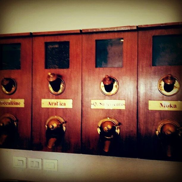 in a row, indoors, text, side by side, metal, communication, western script, yellow, close-up, repetition, no people, number, security, door, metallic, safety, closed, order, architecture, connection