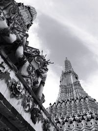 Low angle view of angel statue against building