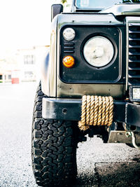 Close-up of vintage car on street