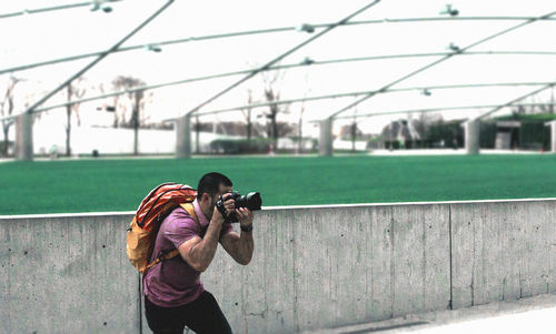 Woman photographing with camera