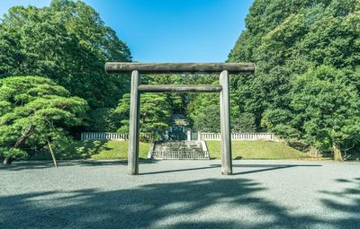 Torii gate against trees at park