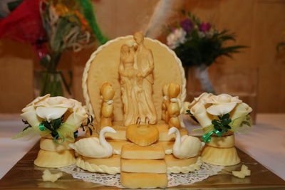 Close-up of bride and groom wedding decoration on table