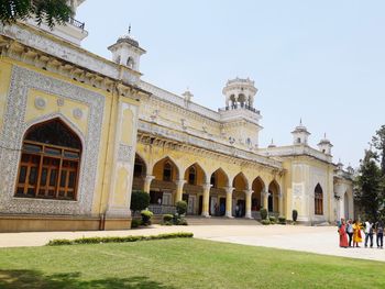 Facade of historic building against clear sky