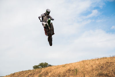 Motorcyclist jumping extreme sports concept