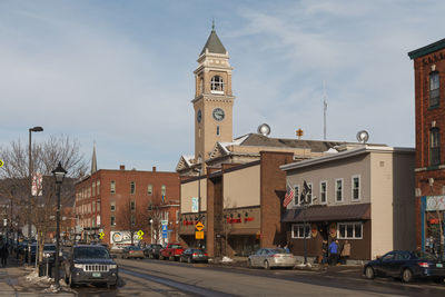 Street amidst buildings in city against sky