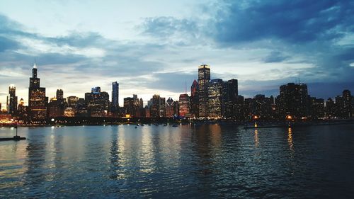 Illuminated city at waterfront