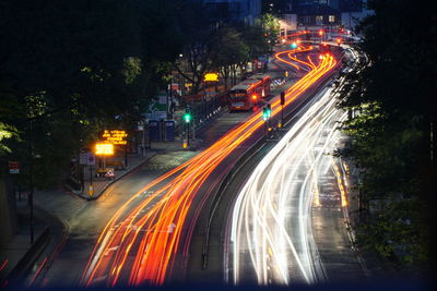 High angle view of light trails on road at night