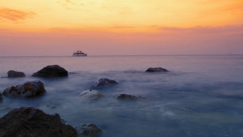 Scenic view of sea against sky during sunset