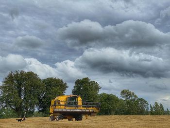 Tractor on field against sky