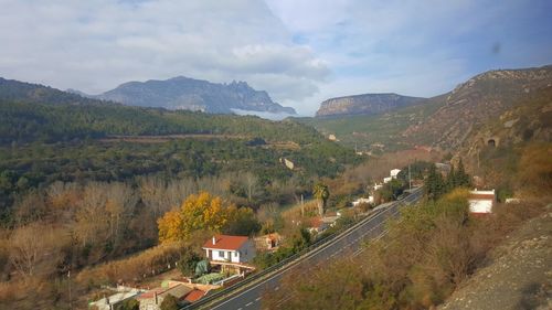 High angle view of trees and mountains against sky