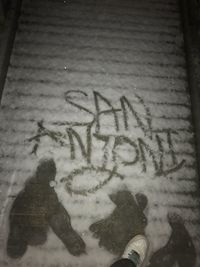 High angle view of text on snow