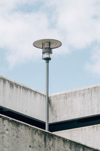 Low angle view of street light against sky