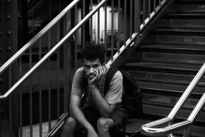 Man sitting on staircase