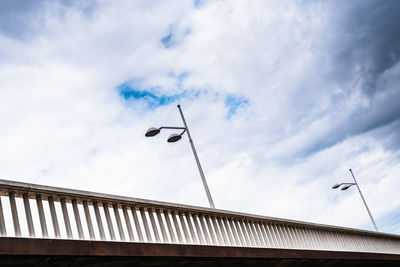 Low angle view of crane against sky