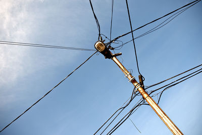 Low angle view of street light against sky