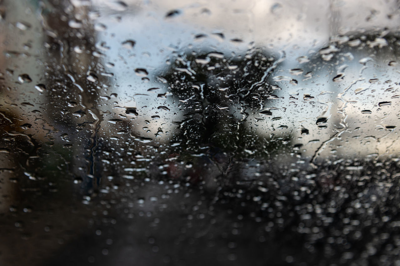 RAINDROPS ON GLASS WINDOW