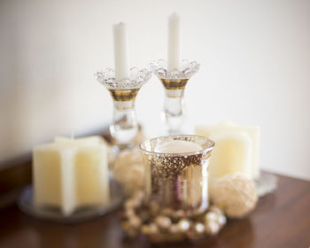 Close-up of wine glasses on table