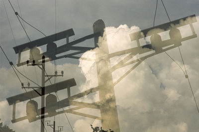 Low angle view of silhouette bridge against sky