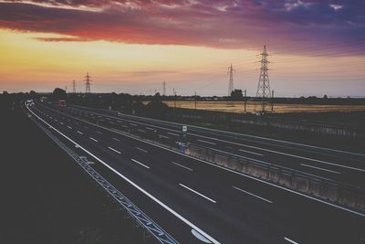 High angle view of railroad tracks against sky during sunset