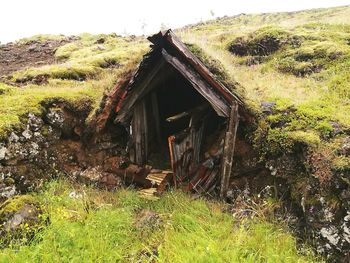 Old house on grassy field