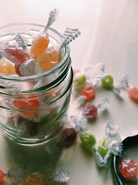 High angle view of candies in jar on table