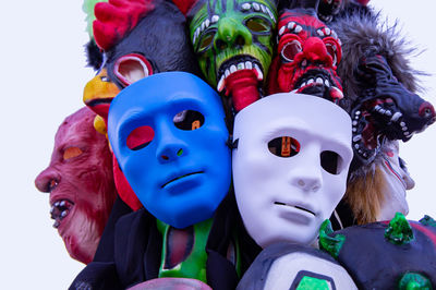 Close-up of masks for sale against white background