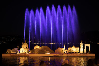 Panoramic view of illuminated building at night