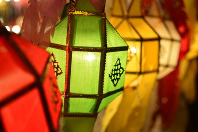 Close-up of illuminated lantern hanging in temple