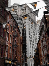 Low angle view of illuminated buildings in city