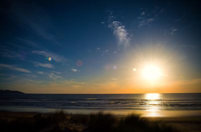 Scenic view of sea against sky at sunset