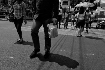 Woman standing on city street