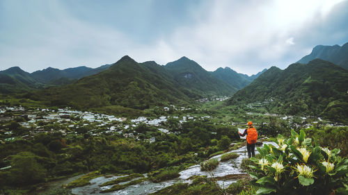 Rear view of man walking on mountain