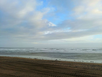 Scenic view of beach against sky