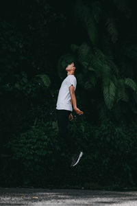 Full length of man standing by tree