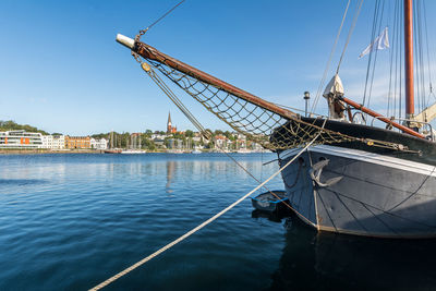 Sailboat sailing in sea against sky