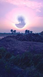 Scenic view of land against sky during sunset