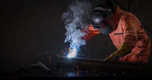 People working on fire at night