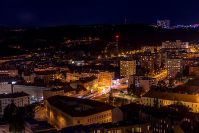 High angle view of illuminated buildings in city at night