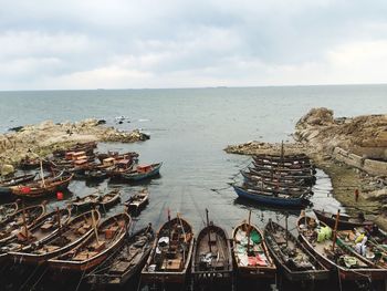 Boats moored at beach