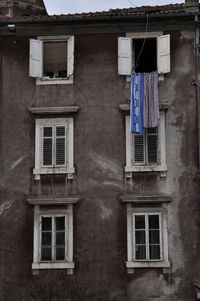 Low angle view of clothes hanging on building