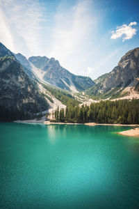 Scenic view of lake and mountains against sky