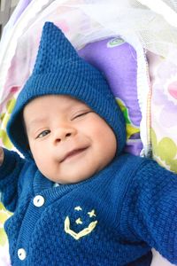 Portrait of cute baby girl lying down