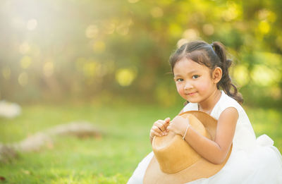 Cute girl sitting outdoors