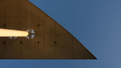 Low angle view of building against clear blue sky