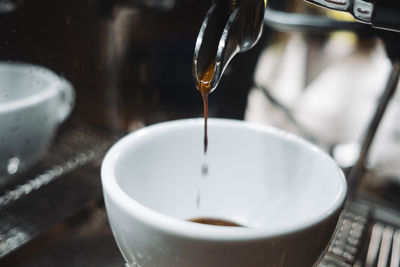 Close-up of coffee cup on table