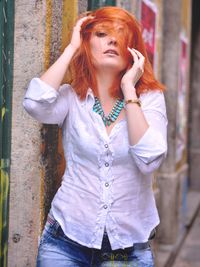 Beautiful young woman standing outdoors