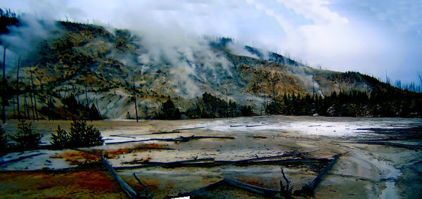 Scenic view of snowcapped mountains against sky