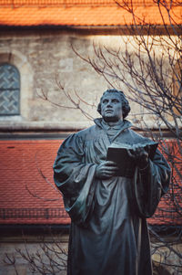 Low angle view of statue against building