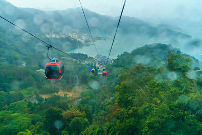 Overhead cable car against sky