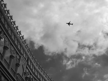 Low angle view of airplane flying in sky